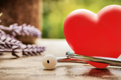 A heart shaped object is sitting next to a stethoscope